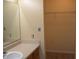 Bathroom featuring a sink, vanity, and large closet with wire shelving at 5708 Outer Bank Rd, Indianapolis, IN 46239