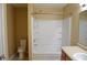 Bathroom featuring a vanity, toilet, and shower-tub combo at 5708 Outer Bank Rd, Indianapolis, IN 46239