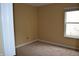 Bedroom with a window, carpet, and neutral colored walls at 5708 Outer Bank Rd, Indianapolis, IN 46239