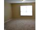 Bedroom with a window letting in lots of natural light and plush carpeting at 5708 Outer Bank Rd, Indianapolis, IN 46239
