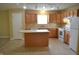 Open kitchen featuring an island, and modern appliances at 5708 Outer Bank Rd, Indianapolis, IN 46239