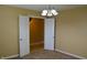 Room featuring neutral walls, carpet and a view of an adjacent room at 5708 Outer Bank Rd, Indianapolis, IN 46239