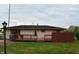 Exterior backyard view featuring a small deck, nice yard, and mature trees at 5979 S Walcott St, Indianapolis, IN 46227
