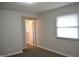 Cozy bedroom featuring neutral carpet and an open doorway to an en-suite bathroom at 5979 S Walcott St, Indianapolis, IN 46227