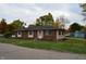 Charming one-story brick home with well-maintained lawn and landscaping under cloudy skies at 5979 S Walcott St, Indianapolis, IN 46227