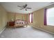 Spacious bedroom featuring a four-poster bed and two windows with red curtains at 6270 Lancaster Pl, Zionsville, IN 46077