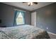 Bedroom featuring a window with blue curtains and neutral carpet at 6270 Lancaster Pl, Zionsville, IN 46077