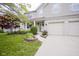 Charming home with a covered porch, brick accents, and a well-manicured lawn at 6270 Lancaster Pl, Zionsville, IN 46077