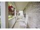 Inviting front porch with white rocking chairs and hanging flower baskets, perfect for relaxing at 6270 Lancaster Pl, Zionsville, IN 46077