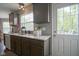 Kitchen area boasts granite countertops, undermount sink, and door to outdoor deck at 6270 Lancaster Pl, Zionsville, IN 46077