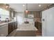 Modern kitchen with granite countertops, stainless steel appliances, and ample cabinet space at 6270 Lancaster Pl, Zionsville, IN 46077