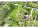 Aerial view of a home nestled among mature trees, with expansive lawn and serene surroundings creating a private retreat at 6340 W 800 S, Pendleton, IN 46064