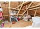 Unfinished attic storage space with wood beams and plywood walls at 6340 W 800 S, Pendleton, IN 46064