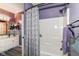 Bathroom features a shower with a patterned curtain and a sink with plenty of counter space at 6340 W 800 S, Pendleton, IN 46064