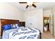 Cozy bedroom featuring a ceiling fan, a window, and a comfortable bed with nautical themed decor at 6340 W 800 S, Pendleton, IN 46064