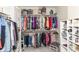 Organized walk-in closet featuring double-hung rods and white shelving for ample storage and efficient space use at 6340 W 800 S, Pendleton, IN 46064