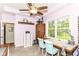 Well-lit craft room with windows, ceiling fan, and sewing stations for crafting enthusiasts at 6340 W 800 S, Pendleton, IN 46064