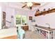 Spacious craft room featuring a window seat, custom storage, and sewing stations for various projects at 6340 W 800 S, Pendleton, IN 46064