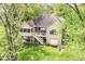 Charming home with a deck, staircase, and lush greenery, offering a blend of comfort and natural beauty at 6340 W 800 S, Pendleton, IN 46064