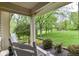Inviting front porch featuring rocking chairs and a view of the verdant lawn at 6340 W 800 S, Pendleton, IN 46064