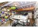 Spacious garage storing a boat on a trailer and various storage containers and shelves at 6340 W 800 S, Pendleton, IN 46064