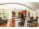 Well-lit kitchen with an island, stainless steel appliances, hardwood floors, and an open concept layout at 6340 W 800 S, Pendleton, IN 46064