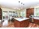 Spacious kitchen with wood floors, a center island, stainless appliances and a breakfast nook at 6340 W 800 S, Pendleton, IN 46064