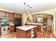 Modern kitchen with stainless steel appliances, light countertops, and hardwood flooring at 6340 W 800 S, Pendleton, IN 46064
