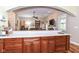 Kitchen with long countertops providing seating and view to the open-concept living room at 6340 W 800 S, Pendleton, IN 46064