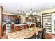 Open kitchen and dining area with stainless appliances, an island, and plenty of natural light at 6340 W 800 S, Pendleton, IN 46064