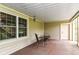 Covered patio with dining table and chairs, and a view of a spacious backyard at 6340 W 800 S, Pendleton, IN 46064