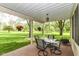 Covered patio with outdoor dining table and chairs, with beautiful views of the backyard at 6340 W 800 S, Pendleton, IN 46064