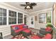 Cozy enclosed porch featuring a sofa, chairs, and windows for ample natural light at 6340 W 800 S, Pendleton, IN 46064