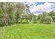 Beautiful expansive lawn with mature trees, offering ample space and a serene, natural environment at 6340 W 800 S, Pendleton, IN 46064