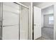 Bathroom showing shower with glass door and view into the bedroom at 6540 Mccreery Ct, Indianapolis, IN 46221