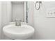 Small bathroom featuring a pedestal sink and mirror at 6540 Mccreery Ct, Indianapolis, IN 46221