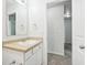 Bathroom featuring a single vanity, a mirror, and access to the hallway at 6540 Mccreery Ct, Indianapolis, IN 46221