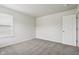 A cozy bedroom offers light-colored walls, neutral carpet, and a bright window at 6540 Mccreery Ct, Indianapolis, IN 46221