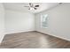 Well-lit bedroom featuring light-colored walls and durable flooring at 6540 Mccreery Ct, Indianapolis, IN 46221