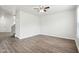 A bright room featuring durable flooring and a ceiling fan at 6540 Mccreery Ct, Indianapolis, IN 46221