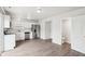 Eat-in kitchen featuring stainless steel appliances, white cabinets, and an adjoining powder room at 6540 Mccreery Ct, Indianapolis, IN 46221