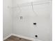 A convenient laundry room includes hookups and shelving for easy organization at 6540 Mccreery Ct, Indianapolis, IN 46221