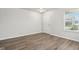 Bright open living space with new vinyl floors and a large window offering natural light at 6540 Mccreery Ct, Indianapolis, IN 46221