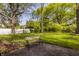 Green backyard with a cozy bench, perfect for relaxation and enjoying nature at 728 E Main St, Carmel, IN 46032