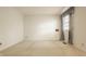 Empty bedroom with carpet, a window, and a simple aesthetic at 728 E Main St, Carmel, IN 46032