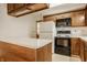Traditional kitchen with wooden cabinets, island countertop, and appliances at 728 E Main St, Carmel, IN 46032