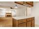 Open concept living room featuring a brick fireplace, built-in shelves, and neutral decor at 728 E Main St, Carmel, IN 46032