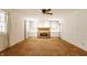 Spacious living room with a fireplace and built-in shelving at 728 E Main St, Carmel, IN 46032