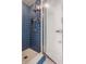 Tiled shower with glass door and a shower head at 728 E Main St, Carmel, IN 46032