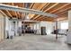Unfinished basement with concrete floor, exposed wooden ceiling, and lots of space at 769 Canberra Blvd, Westfield, IN 46074